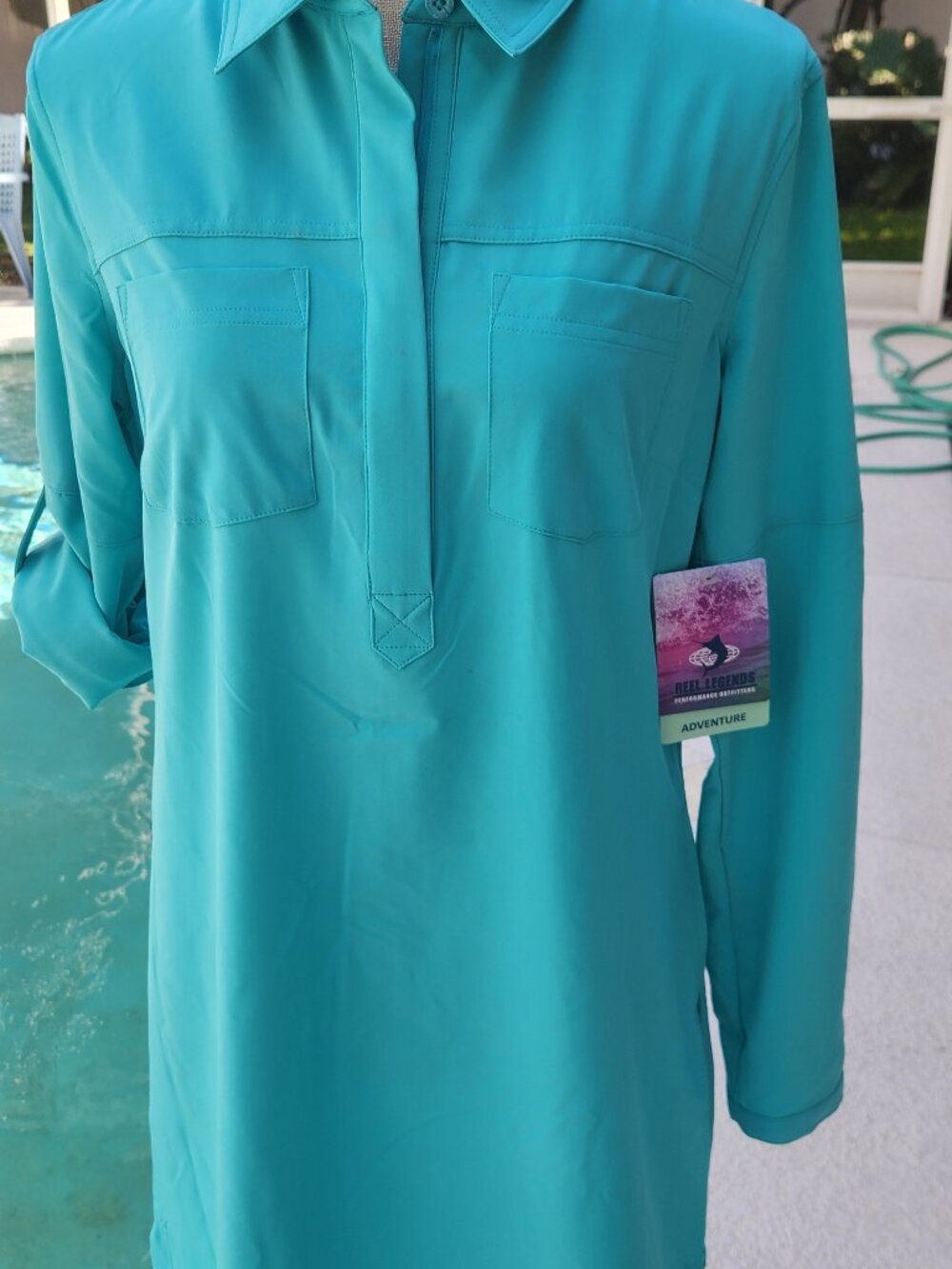 New with tag Reel Legend L sleeve dress. size Medium Petite. UPF 50 Peacock Blue